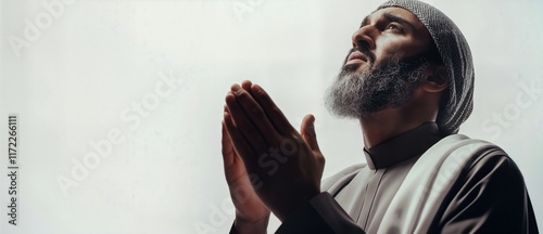 Old Muslim Man with beards praying, raising hands for prayer with faith and hope. Copy space for text