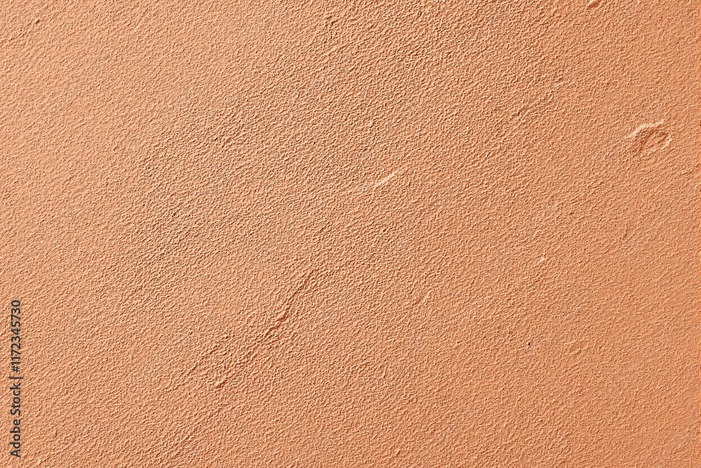 Fototapeta premium Close-up of rough-textured orange wall surface, natural light enhances the detail, ideal for background or design concepts. Ai generative