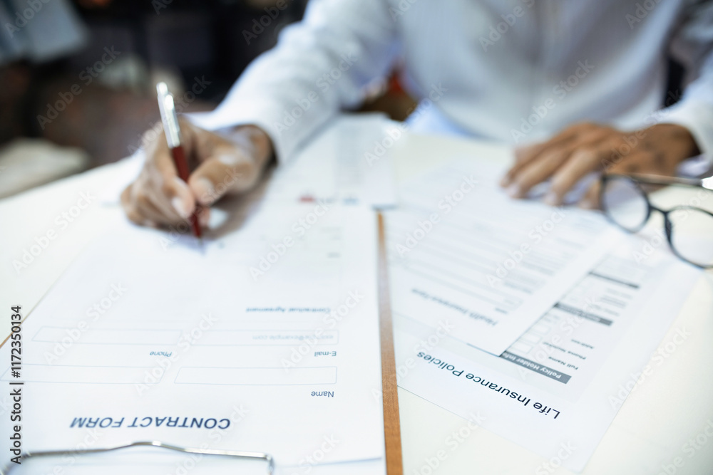 Blur hand of asian man reading contract making deal with life insurance agent before sign. concept for consultant health insurance, life insurance savings plan, select focus at document Blur hand of asian man reading contract making deal with life insurance agent before sign. concept for consultant health insurance, life insurance savings plan, select focus at document