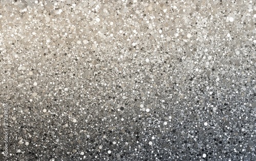 A seamless, top view of incredibly fine, small particles in a gradient from soft grey to light silver and pale ash.