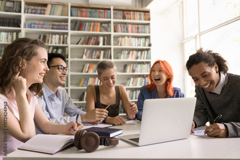Education on distance. Happy friendly diverse group polyethnic students teenagers learn remotely at public library attend virtual class using computer app laugh on prof joke handwrite lecture theses Education on distance. Happy friendly diverse group polyethnic students teenagers learn remotely at public library attend virtual class using computer app laugh on prof joke handwrite lecture theses