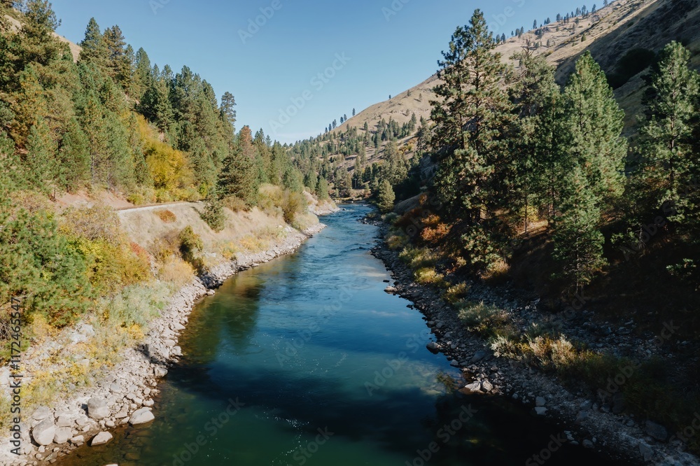 Tranquil river winding through autumnal forest. Scenic landscape, fall colors. Payette River, Horseshoe Bend, Idaho, USA. Tranquil river winding through autumnal forest. Scenic landscape, fall colors. Payette River, Horseshoe Bend, Idaho, USA.