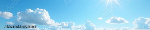 Gentle white clouds in the clear blue spring sky with a few scattered sunlit rays, light, cloud, blue
