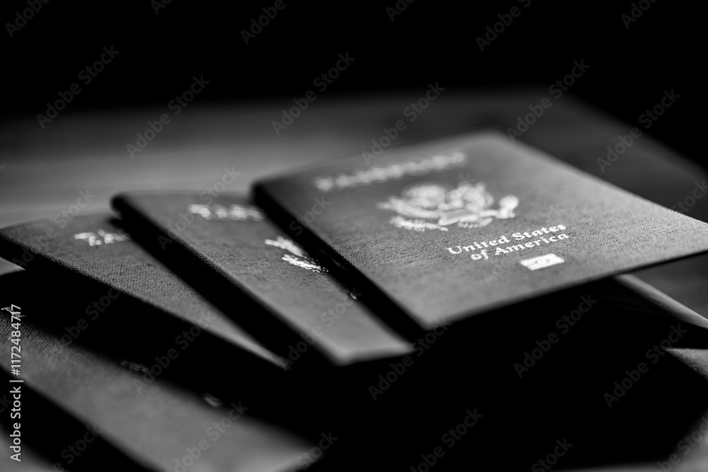 Black and white US passports on table. Black and white US passports on table.