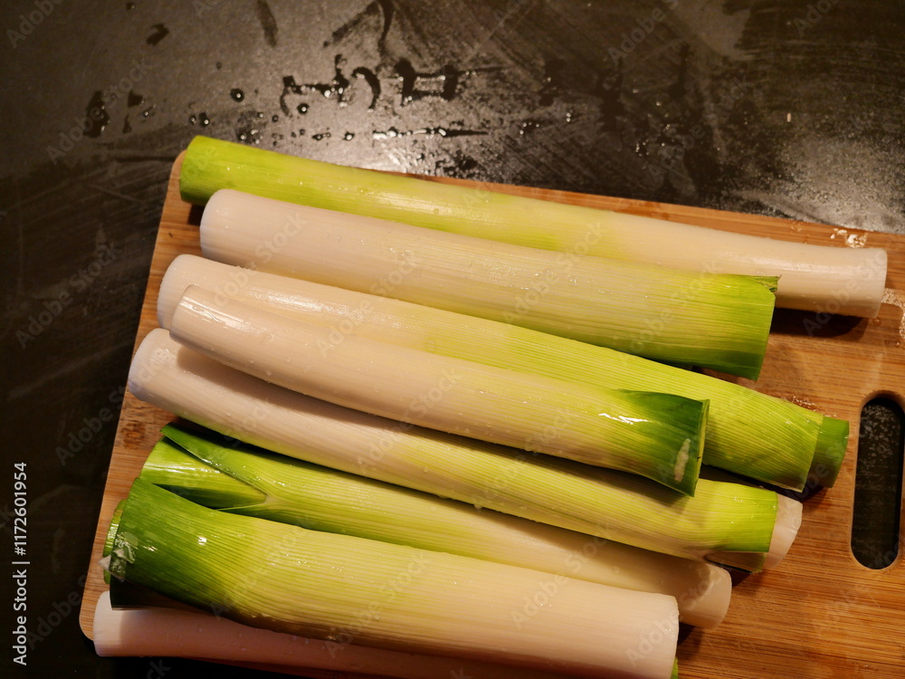 Sliced leeks. Fresh leeks, washed, peeled and cut for cheese leek soup, for example. Food photography for designs and backgrounds Sliced leeks. Fresh leeks, washed, peeled and cut for cheese leek soup, for example. Food photography for designs and backgrounds
