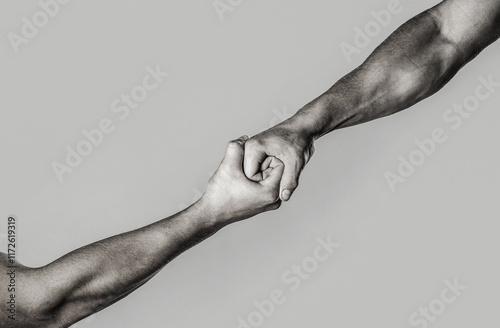 Concept of salvation, donorship, helping hand. Helping hand outstretched, isolated arm, salvation. Human's hand saving another human. Black and white