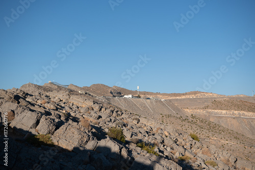 Jebel Jais, the UAE's tallest peak, offers breathtaking views, thrilling ziplines, and cool weather. A serene retreat for adventurers and nature lovers with stunning sunsets.