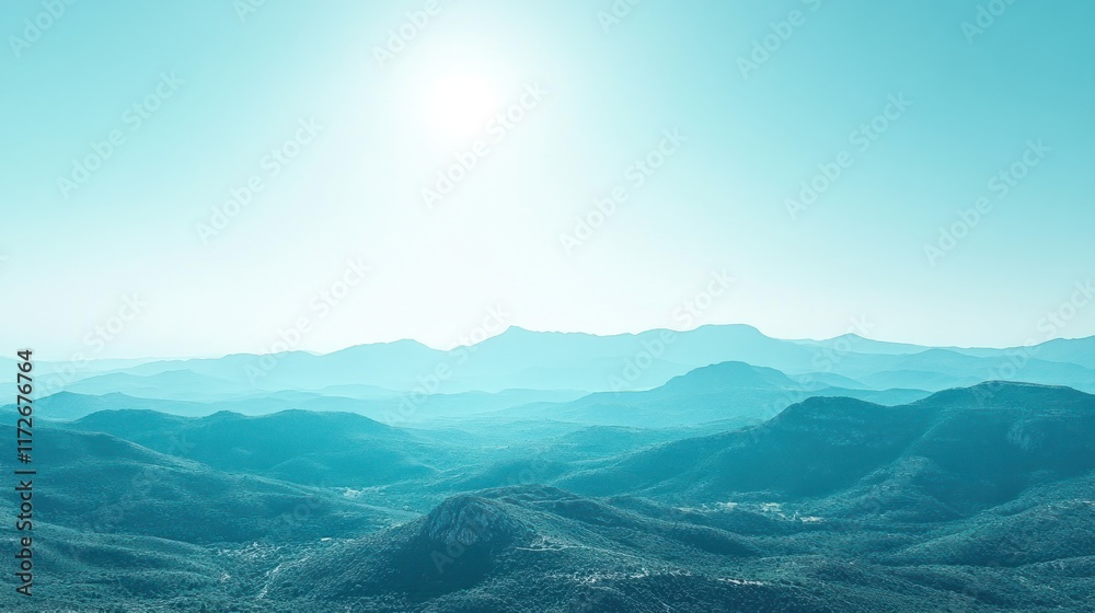 Obraz premium Serene mountain range vista, summer sunlight, hazy sky, peaceful landscape; ideal for travel brochures.