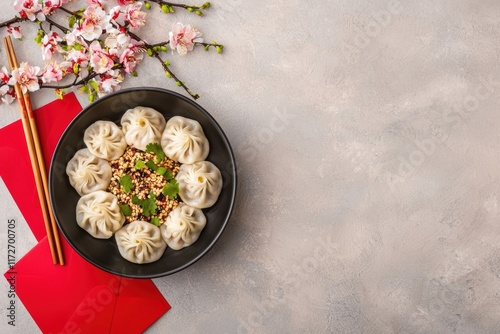 Steamed dumplings and red envelopes celebrating chinese new year with copy space photo