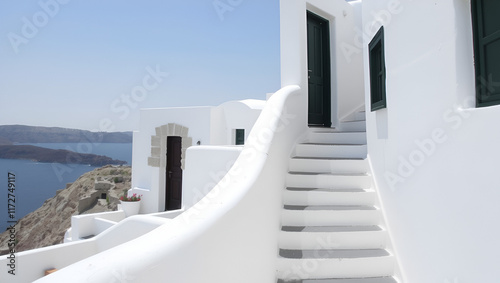 Simple staircase twisting through traditional Mediterranean whitewashed architecture on the Greek island of Santorini