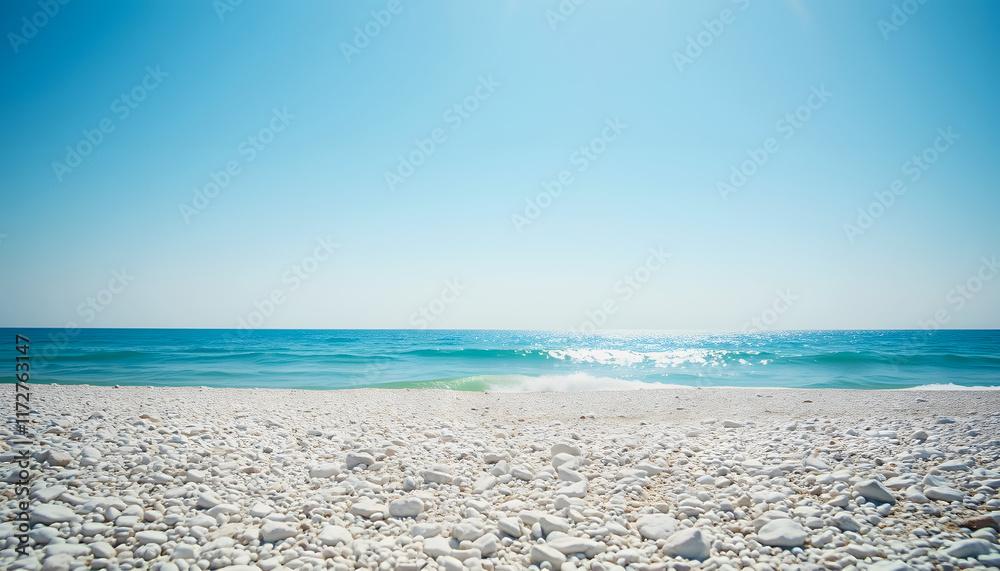 Pebbly white beach on a sunny day, against clear blue sky; can be used as summer background. Filtered image in faded, washed-out, retro style, with dark vignette; summer vintage concept, sticker sty Pebbly white beach on a sunny day, against clear blue sky; can be used as summer background. Filtered image in faded, washed-out, retro style, with dark vignette; summer vintage concept, sticker sty