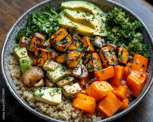 Roasted sweet potato, quinoa, avocado, and mushroom bowl.