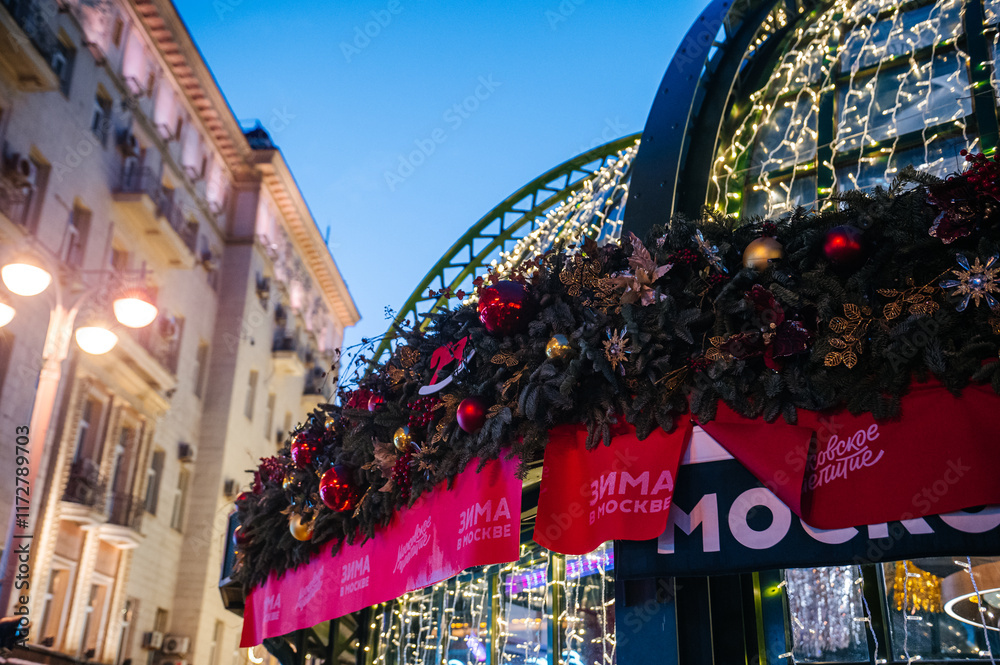 Fototapeta premium MOSCOW, RUSSIA - 12.21.2024: New Year's illumination at the festival site on Tverskaya Street