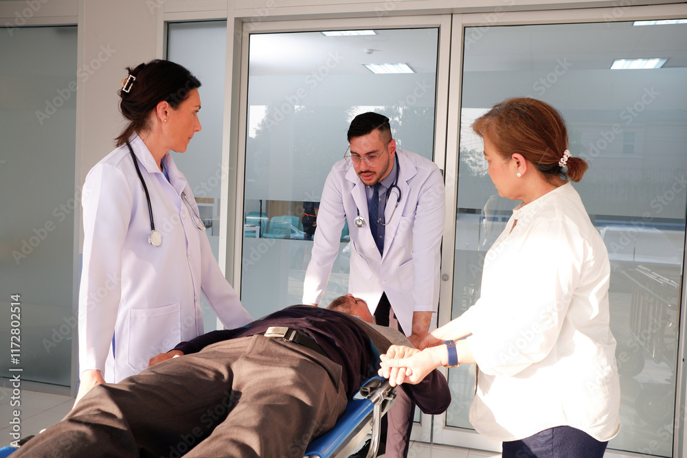 Fototapeta premium Female and male doctors are pushing a patient into the emergency room.