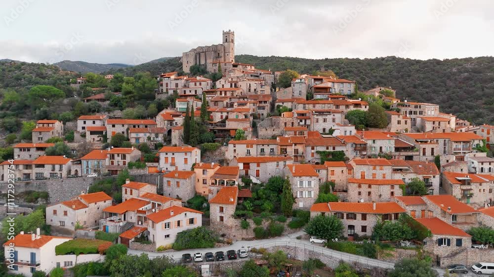 Aerial view of Eus, the medieval hilltop town in Pyrenees mountains, France. Aerial view of Eus, the medieval hilltop town in Pyrenees mountains, France.