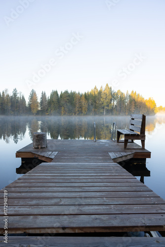 Foggy mornign by the lake in fall
