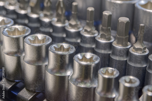 Set of torx, hex and phillips screwdriver heads and sockets of different sizes in a toolbox