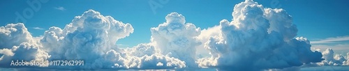 Cumulus clouds develop into towering thunderheads as winds push them against cirrus clouds , cumulus, windy