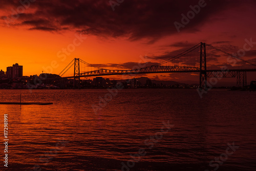 Old Hercilio luz cable bridge with sunset in Florianopolis photo