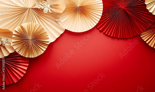 Decorative arrangement of red paper fans and cherry blossoms on a textured background
