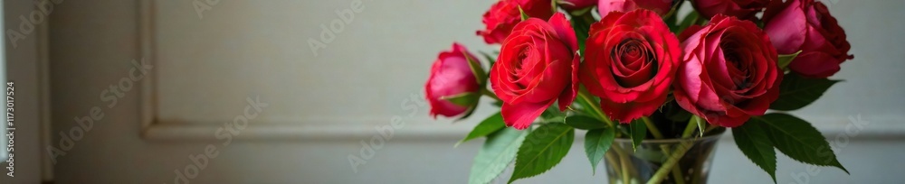 Naklejka premium Exquisite floral arrangement with red roses and peonies in an elegant glass vase, decorative, roses, elegant