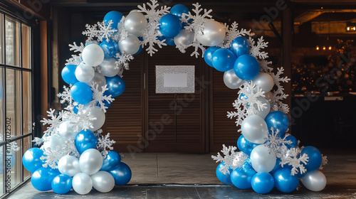 Balloon arch with snowflakes, blue and white, winter theme.