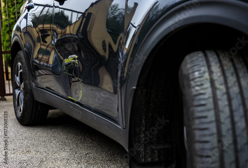 Due to the driver's inattention, the car crashed into a wall and bent the metal plate on the suv car door