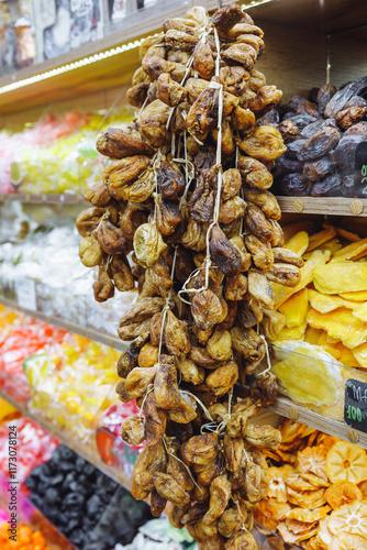 Strings of dried figs in a dry fruit store. photo