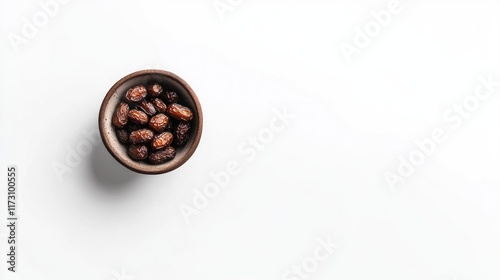 Dates in a Small Brown Bowl on White Background