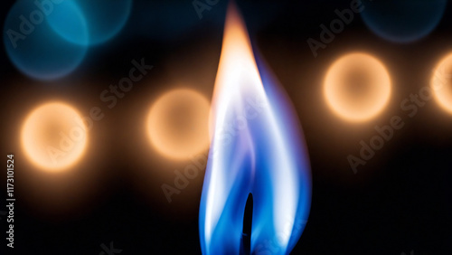 Candle flame glowing softly in blue hues, macro.