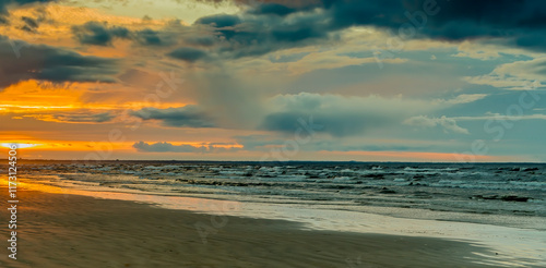 Colorful sunset on sandy beach of the Baltic Sea. No AI tools were used
