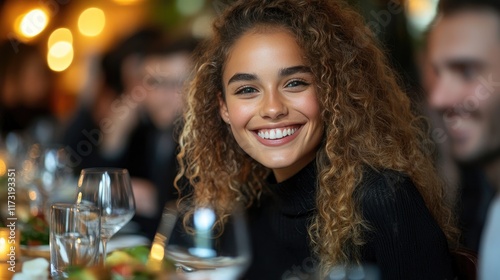 Joyful Woman Smiling at Dinner Party with Friends and Warm Lighting Ambiance