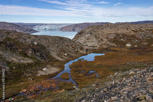 Beautiful sunset in front of Qaleraliq glacier (South Greenland) photo