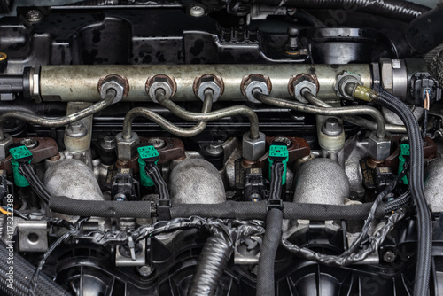 Close-up of fuel injectors and common rail in a diesel engine