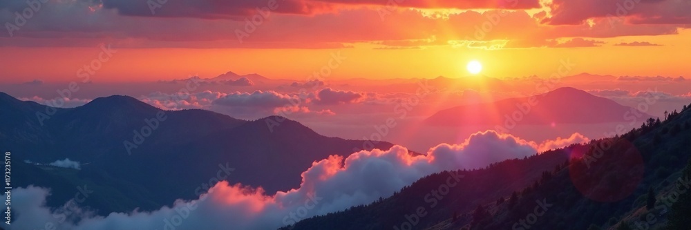 Fototapeta premium Amber sun sinks behind layered clouds on mountainside, warm, cloud, mountain