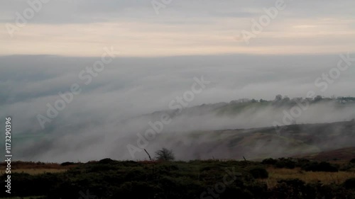 Clee Hill geen moor near Ludlow, Shropshire, looking across at a temperature inversion, low clouds or water vapour, wide angle, landscape. Telephoto