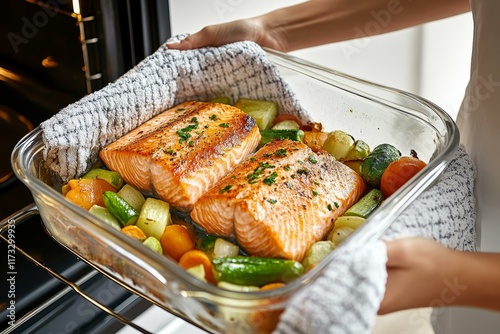 Baked Salmon with Vegetables in Glass Baking Dish photo
