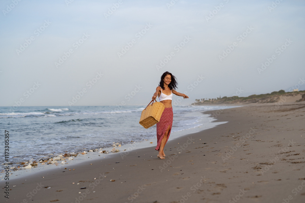 Young Woman Walking and Smiling on the Beach Young Woman Walking and Smiling on the Beach