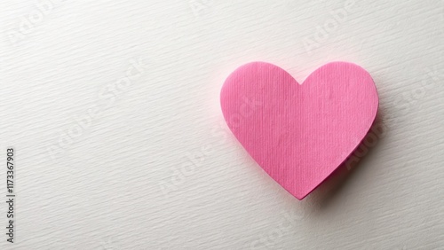 Pink paper Valentine's Day heart with a subtle texture and a soft focus effect
