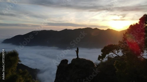silhouette of a person in the mountains