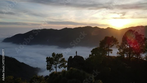 silhouette of a person in the mountains