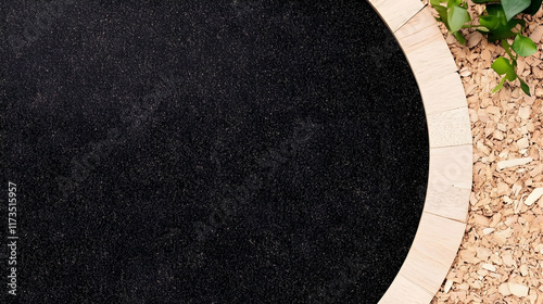 Dark soil in circular wooden planter, mulch background, gardening preparation.  Use website header, blog post, gardening guide.
