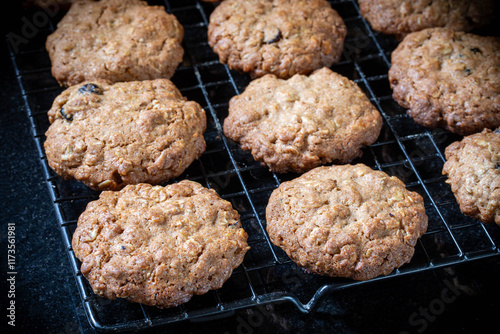 Oatmeal cookies. Oatmeal cookies with nuts and dried cranberries on a dark background.
