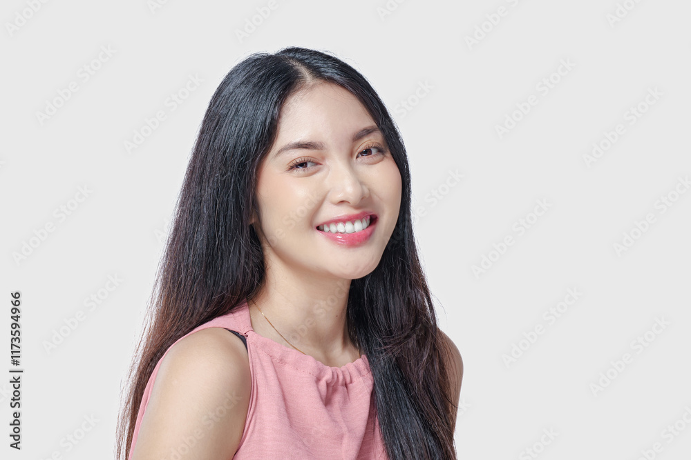 Excited young Asian woman wearing pink dress with a joyful expression, isolated by white background. Excited young Asian woman wearing pink dress with a joyful expression, isolated by white background.