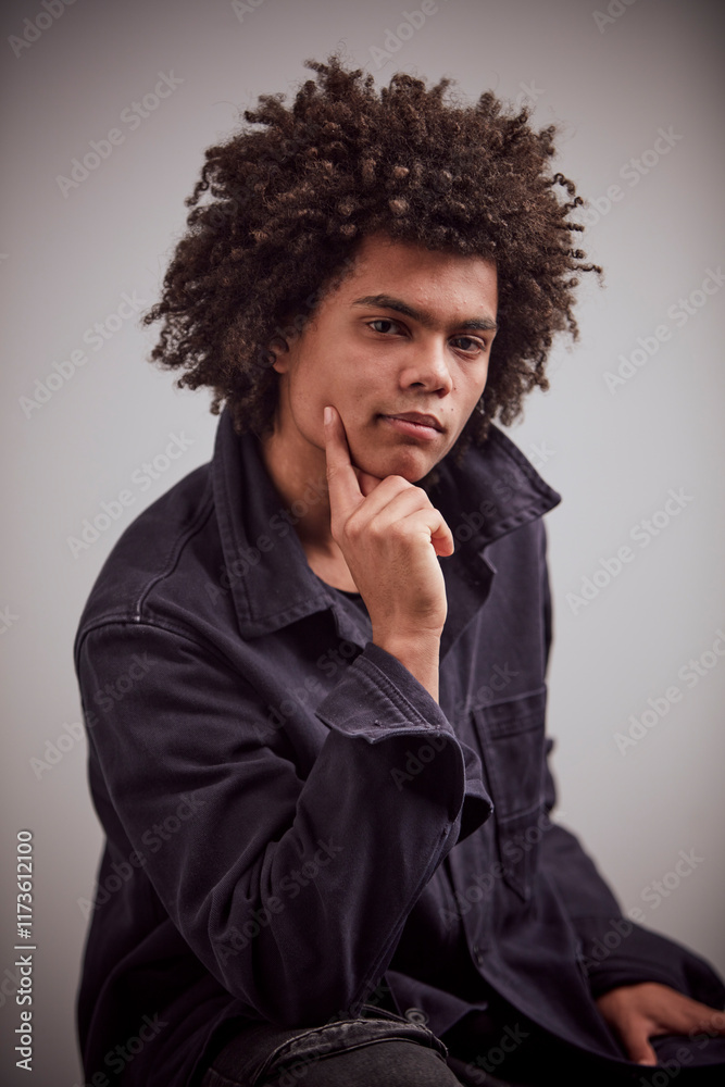 Studio Portrait of a young mixed race man. Studio Portrait of a young mixed race man.