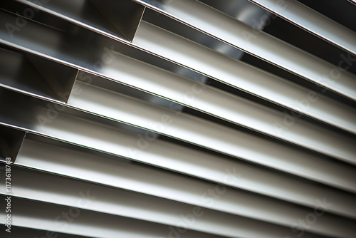 Close-up Detailed View of a Modern, Metallic HVAC Vent Installed in Wall photo