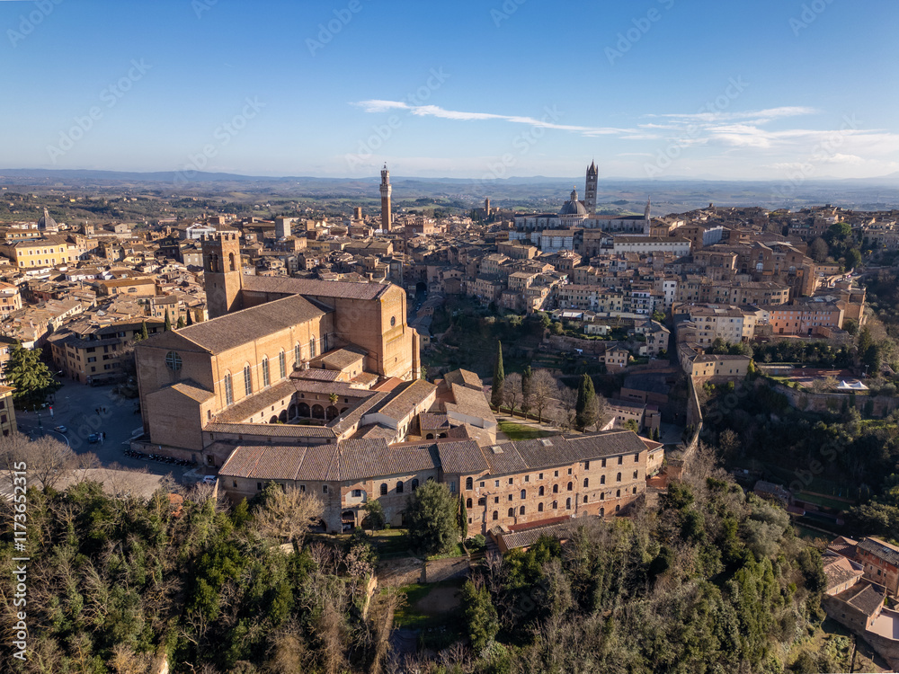 Aerial drone view of a cathedral in the old city center of Siena in Tuscany, Italy. Aerial drone view of a cathedral in the old city center of Siena in Tuscany, Italy.