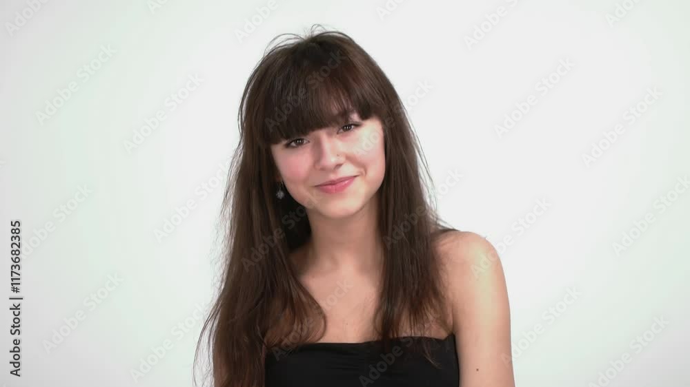 Young Woman in Studio Displaying Joyful Expressions