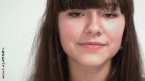 Friendly Young Woman Posing for the Camera in Studio