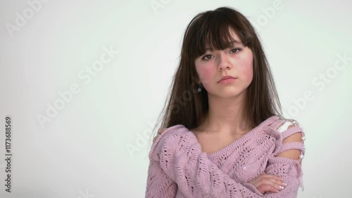 Contemplative Young Woman Posing in Studio Setting